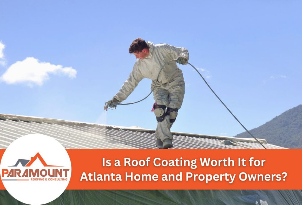 Worker applying roof coating under a clear blue sky