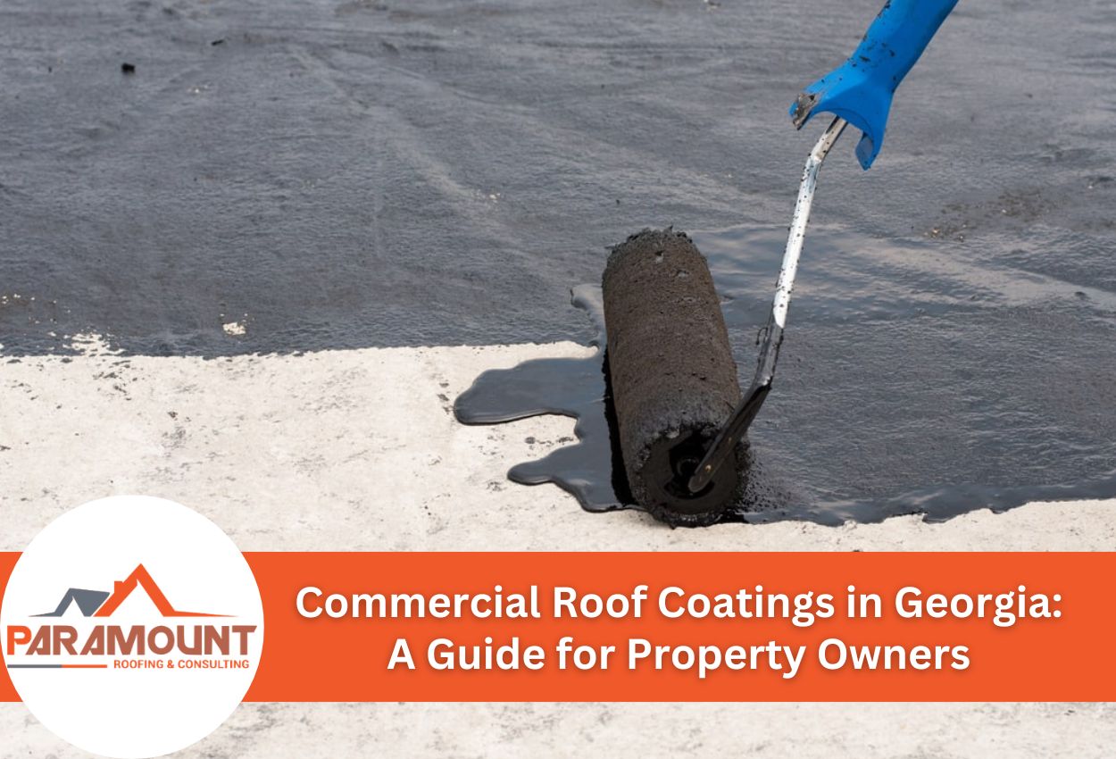 Roller applying roof coating on commercial building surface