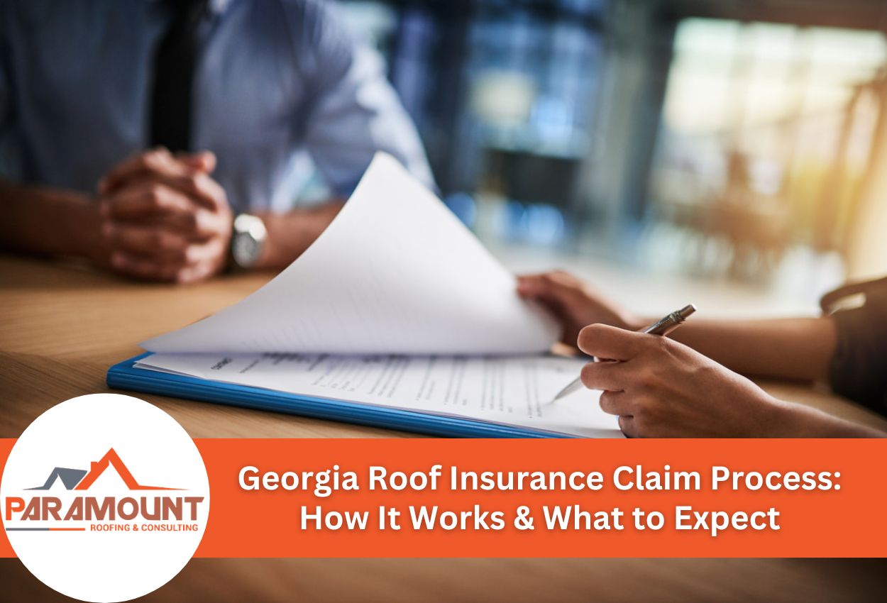 Close-up of hands discussing roof insurance claim paperwork